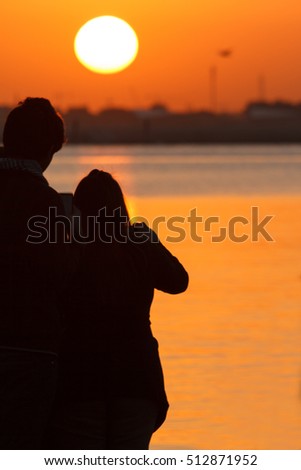 Couple watching sunrise 