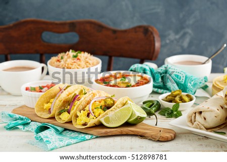 Breakfast tacos with scrambled eggs and hot chocolate