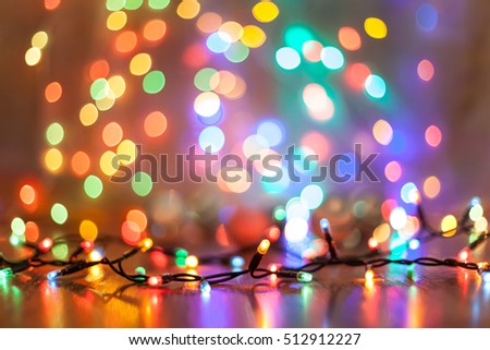 art Christmasl lights on a wooden background Royalty-Free Stock Photo #512912227