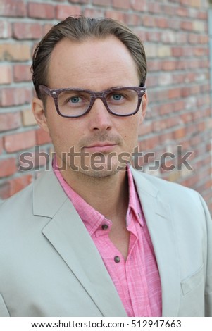 Head shot of businessman wearing glasses - outdoor picture