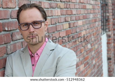 Head shot of businessman wearing glasses - outdoor picture with copy space