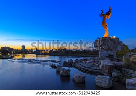 Keeper of the Plains Indian in Wichita, Kansas at sunrise. A steel sculpture by Blackbear Bosin that stands at the fork of the Arkansas River.