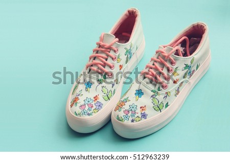 Painted Floral Canvas Shoes Royalty-Free Stock Photo #512963239