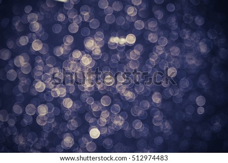 abstract blue bokeh background. bokeh of water fly and lights on black background.Blue Festive Christmas elegant abstract background. Vintage