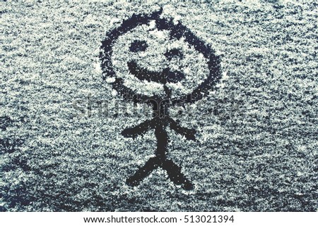 Smile on the snowy car window