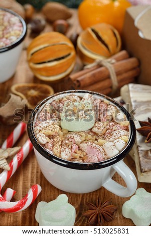 Christmas hot chocolate with marshmallows on a brown background