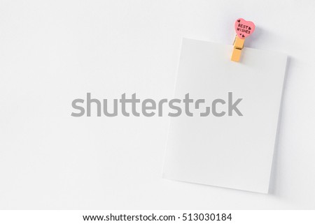 Abstract of wooden heart clip with Blank paper and stick paper white background. paper note copy space for add text. valentine picture message for greeting card background.
