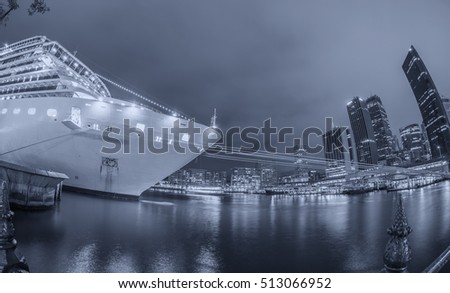 Ship anchored in Sydney port, night view.