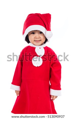 Happy Asian Chinese little girl wearing santa claus costume in isolated white background.