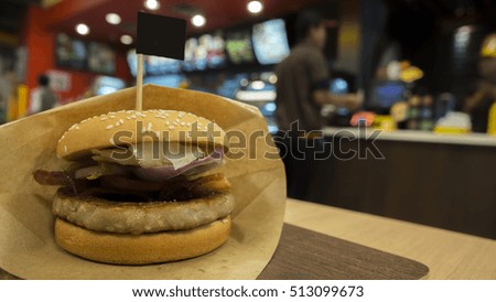 Big pork burger that is junk food at fast food restaurant