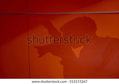 Shadow of photographer on wall