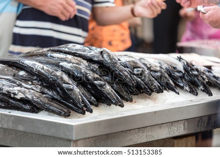 Fish on market, black scabbard (espada) in fish market Royalty-Free Stock Photo #513153385