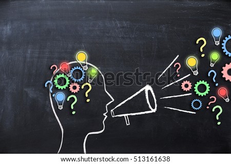Share your knowledge concept with human head shape on blackboard Royalty-Free Stock Photo #513161638