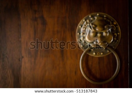 Blur photo , China style door handle on natural wooden door