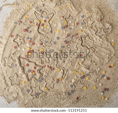 Abstract Christmas food background with cookies molds and flour