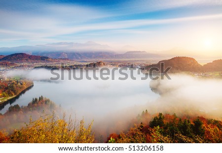 Aerial view of the alpine lake Bled from Osojnica. Great and gorgeous morning scene. Popular tourist attraction. Location famous place Julian Alps, Slovenia, Europe. Artistic picture. Beauty world.