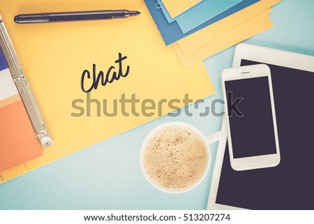 Notepad on workplace table and written CHAT concept