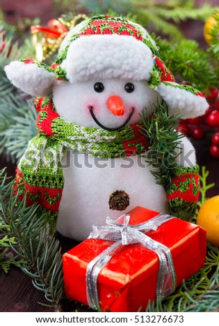 The photograph depicts Christmas background with toys