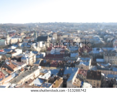 Old town panorama from tower. Blurred photo of Lviv, Ukraine. Lviv historical city center view in blur. Old Europe urban landscape. Romantic rooftop image. Geneva architecture blurry picture