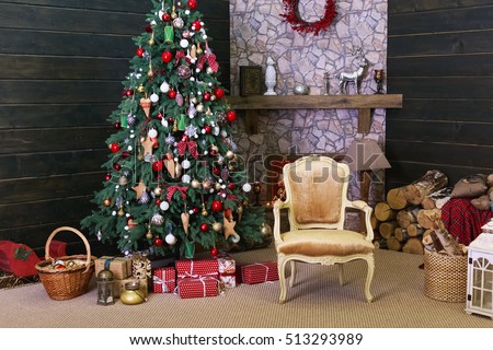 Christmas interior in the photo studio. The decorated Christmas tree, fireplace and gifts. Royalty-Free Stock Photo #513293989
