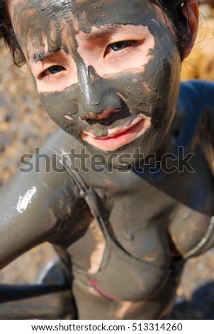 Cute Girl with mud at Dead Sea, Jordan