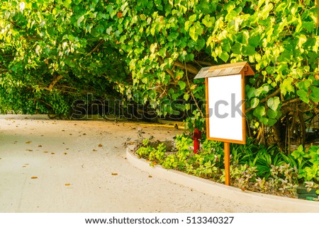 Wood sign  in green garden