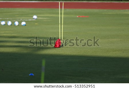 balls and football training equipment at a soccer pitch