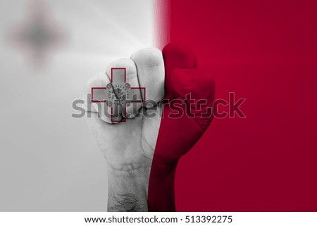 Man hand fist of MALTA flag painted