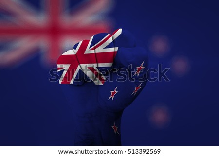 Man hand fist of NEW ZEALAND flag painted