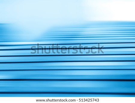 Horizontal motion blur blue stairs background