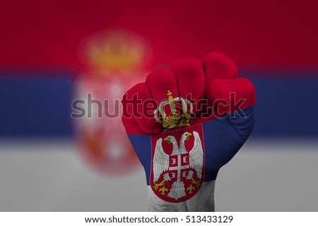 Man hand fist of SERBIA flag painted