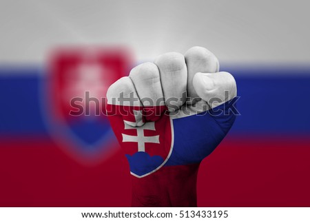 Man hand fist of SLOVAKIA flag painted