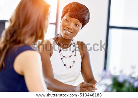 Women working together, office interior Royalty-Free Stock Photo #513448183