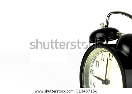 Alarm Clock on white, showing nine o'clock.
