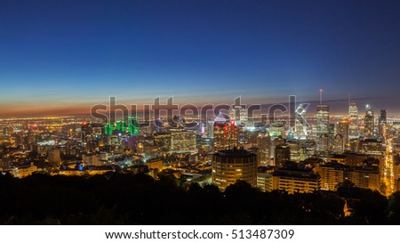 Panoramic skyline view over the city of Montreal at dawn on a summer day seen from the Mount-Royal, Canada