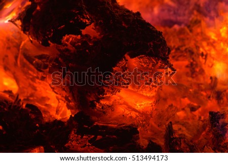 Glowing embers in hot red color. Embers closeup. Embers after a fire.