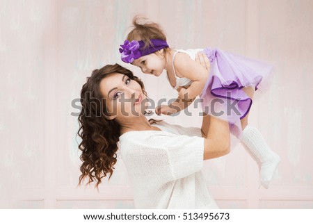 Happy loving family. mother and child girl playing and hugging

