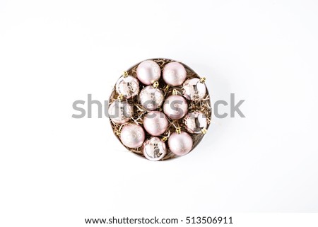 round box with bright christmas balls on white background. flat lay, top view