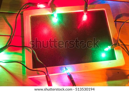 Empty Christmas card with colorful lights. Free space for text