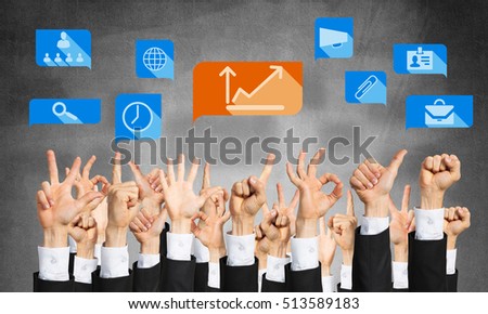Many hands of businesspeople showing different gestures