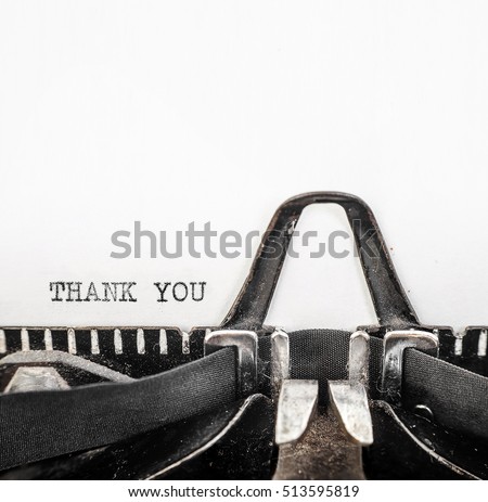 Vintage typewriter with ' THANK YOU ' typed onto white paper with copy space.