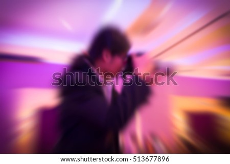 Blurry portrait  of photographer working