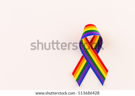 Rainbow Gay Pride ribbon on a white background.