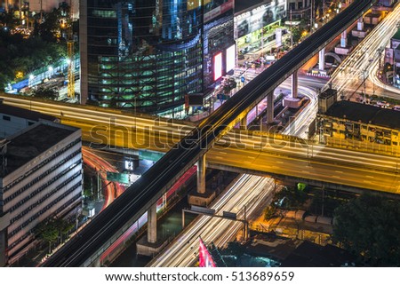 Express way at night time in Bangkok, Thailand (With long exposure photography created movement of car light and blur trademark, brand, logo)