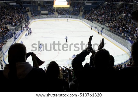hockey fans applause on the stadium  Royalty-Free Stock Photo #513761320