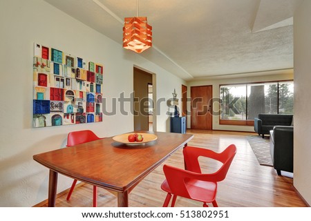 Dining area interior with red chairs, apples on the table. Northwest, USA