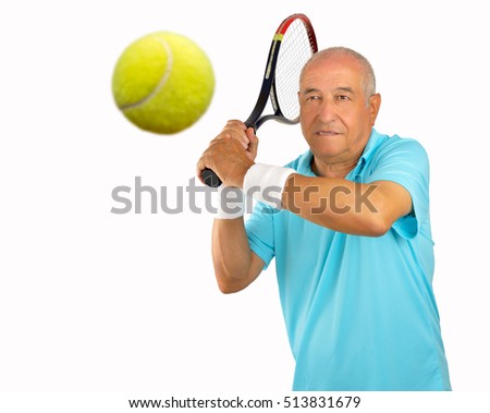 portrait of a senior man tennis player standing and swatting the ball