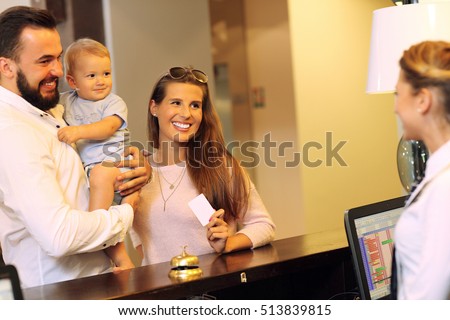 Picture of family checking in hotel Royalty-Free Stock Photo #513839815