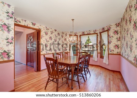 Retro look of dining room with wooden carved table set and hardwood floor. Northwest, USA