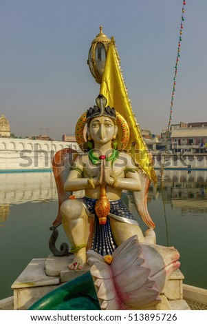 Statue of the Hindu mythical creature by the sacred pond in the Hindu Temple in India